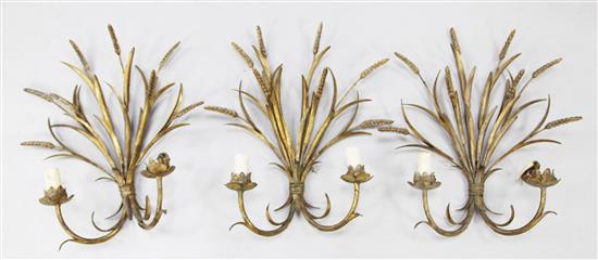 A set of three gilt metal wall lights, height 19in.